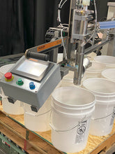 Load image into Gallery viewer, Drum tote pail filling machine filling 12 pails on a pallet
