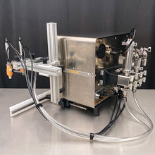 Load image into Gallery viewer, Rear side view of the tabletop FG-200 bottle filling machine with push-to-connect hoses and EZ Adjust Nozzle Arm in a stainless steel table
