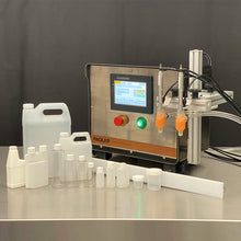 Load image into Gallery viewer, Tabletop FG-200 bottle filling machine with 1oz, 4oz, 8oz, 16oz, 32oz quart, 128oz gallon bottles on a stainless steel table